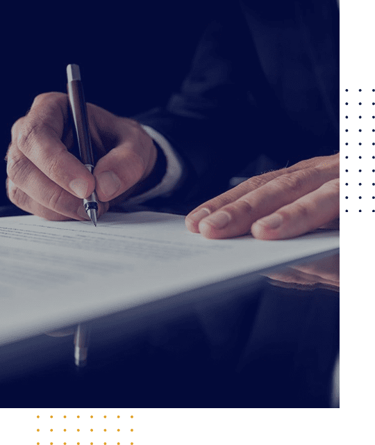 Person signing a document with a pen.